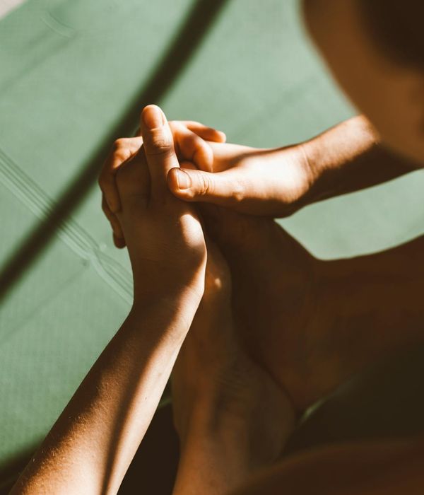 Close-up shot of hands in a mindful gesture during a yoga practice, focus on detail.
